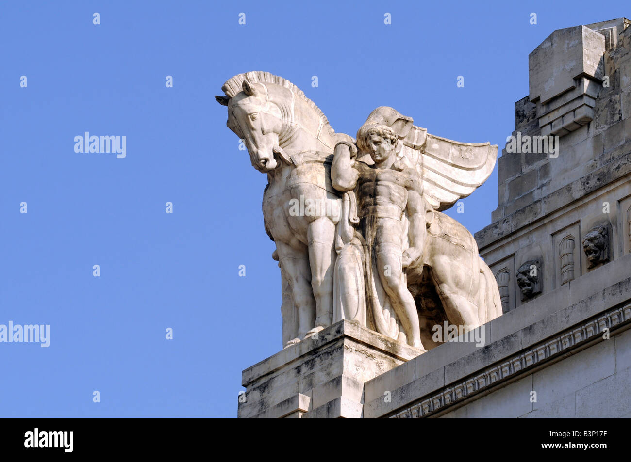 Statue of a horse and a man on the roof of Milan central train station, a masterwork of grand fascist architecture, in Italy. Stock Photo