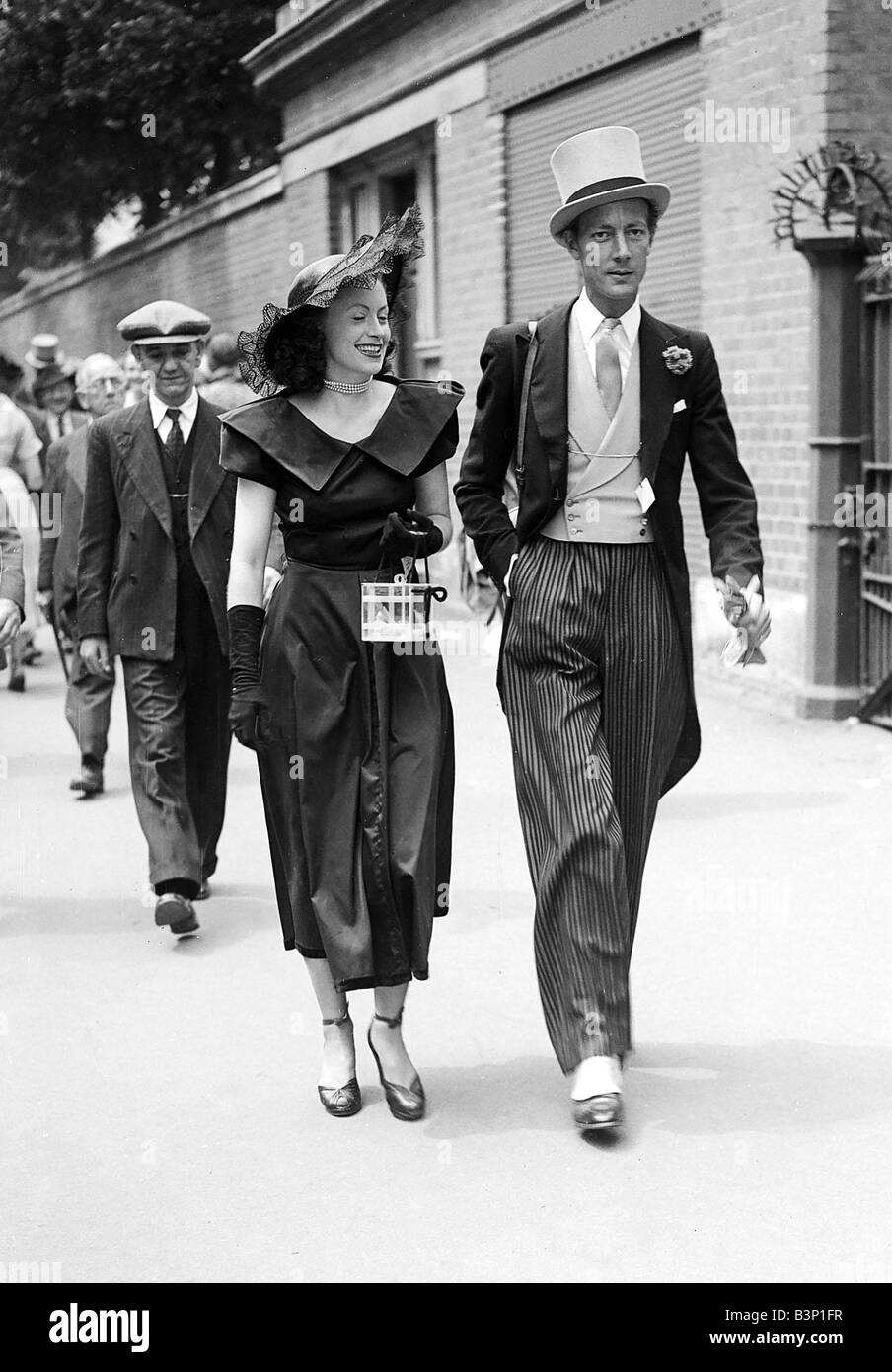 1949 Clothing Ascot Fashion Two racegoers walk down the street to the ...