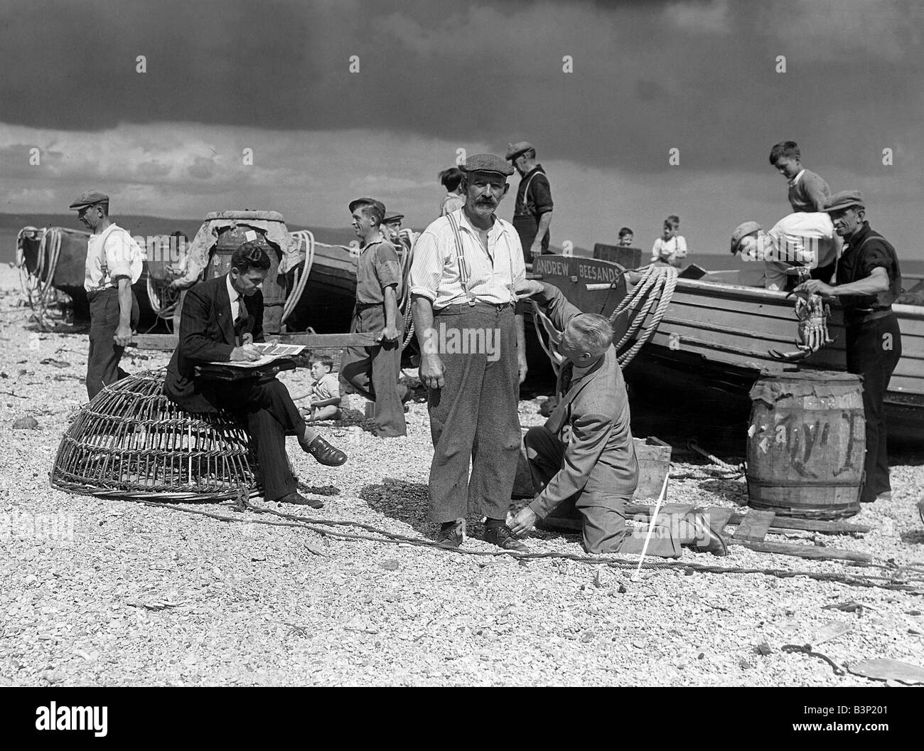 Clothing Fashion 1940 s Fisherman Alf Steer being measured by Henry Blythe Tailoring Circa 1945 Stock Photo