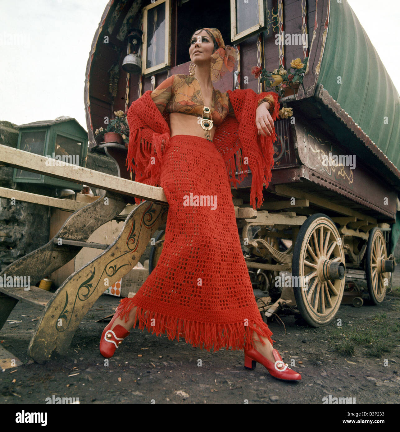 Model Liz Wiloughby wearing a hand crocheted skirt and fringe shawl Clothing Fashion Gipsy Romany Caravan December 1969 1960s Mirropix CR 6367 7 Neil Campbell Sharp 22 12 1969 Stock Photo