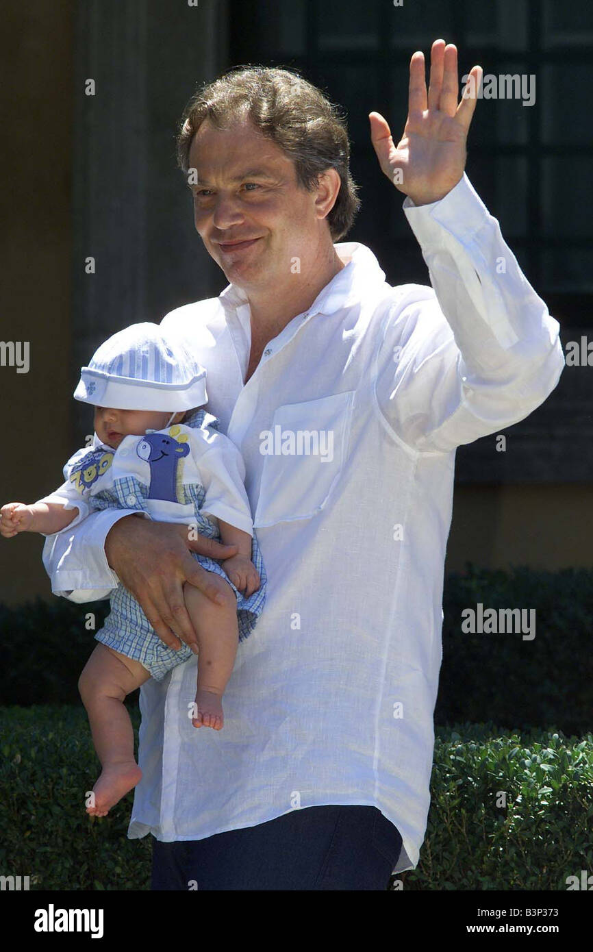 British Prime Minister Tony Blair holds his son Leo August 2000 at the