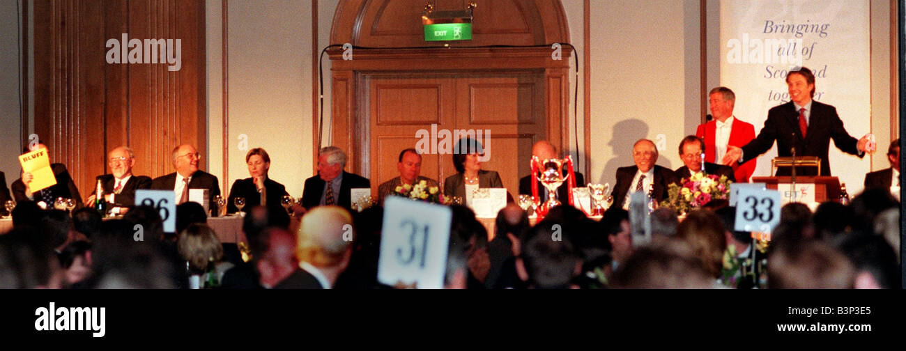 Tony Blair April 1999 speaking at the newspaper press fund lunch Glasgow SNP leader Alex Salmond MP holds up his Bluff Card Stock Photo