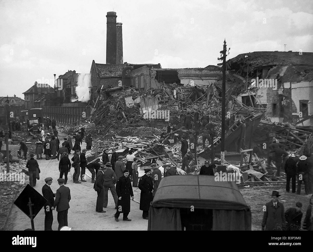 WW2 Air Raids Ilford Essex East London WW2 Bomb damage in Ilford East London after an air raid is looked over by emergency service as they look for survivors amongst the rubble of collapsed buildings homes and factorys Stock Photo