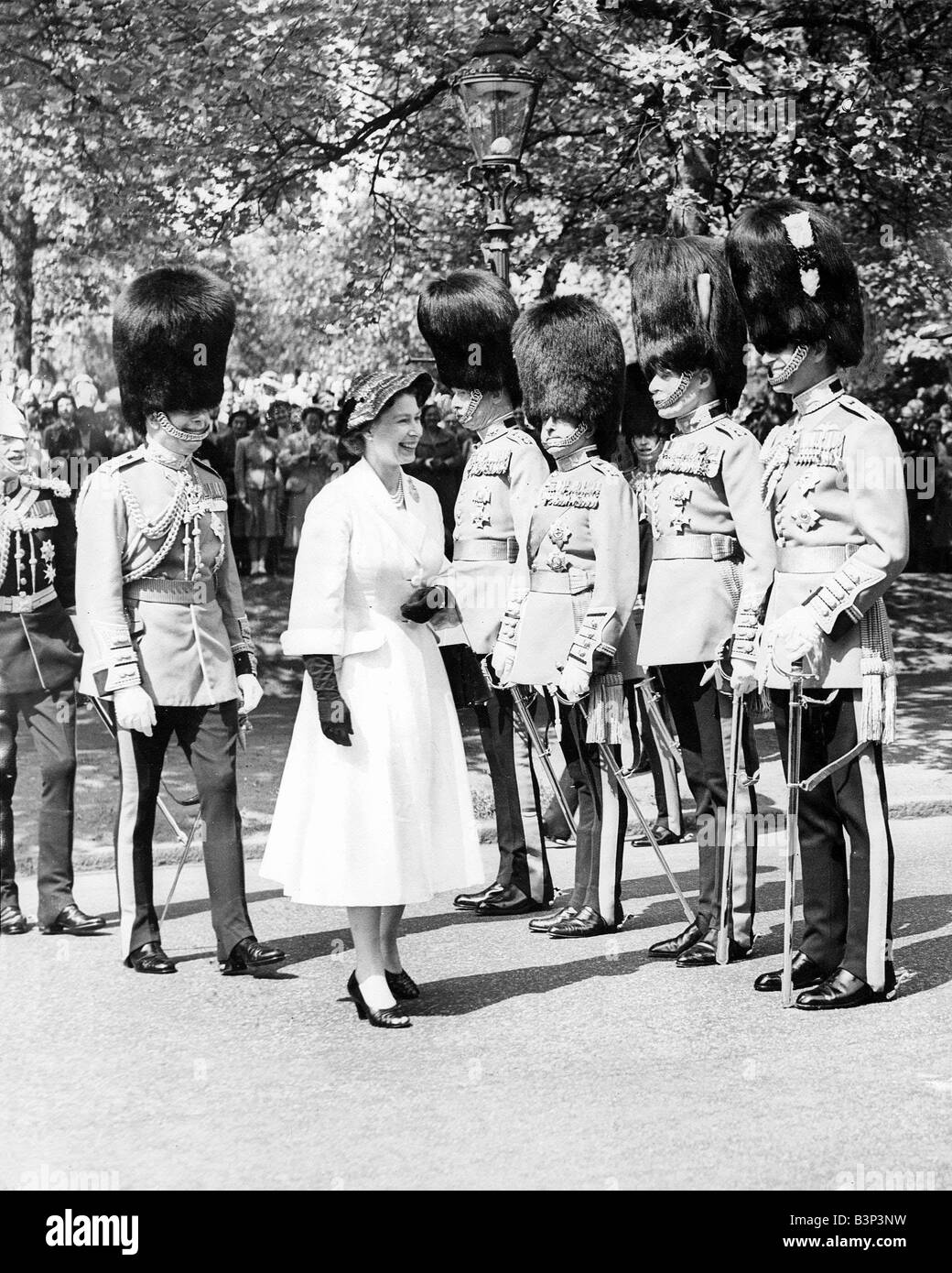 Queen Elizabeth ll Inspecting Guards May 1956 With the Duke of Gloucester the Queen meets the Regimental Colonels of her Household Brigade The Duke of Edinburgh extreme right Colonel of the Welsh Guards also FROM LEFT General Sir Henry Loyd Coldstream Guards Field Marshal Earl Alexander Irish Guards and General Lord Jeffreys Grenadiers The Queen opening the Household Brigade Memprial Clioster in Birdcage Walk The Cloister which is part of the design for the restored Chapel of Wellington Barracks damaged by a fire bombing is in memory of officers and men of the Household Brigade who died in WW2 Stock Photo
