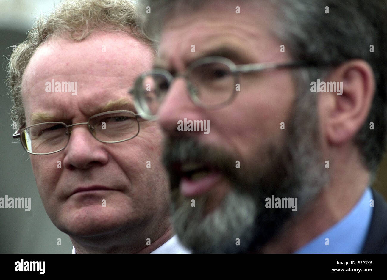 Pro Agreement Summit At Hillsborough Castle July 2002 Sinn Fein s Martin McGuinness and Gerry Adams speaking outside Hillsborough Castle before meeting Prime Ministers Tony Blair and Bertie Ahern Stock Photo