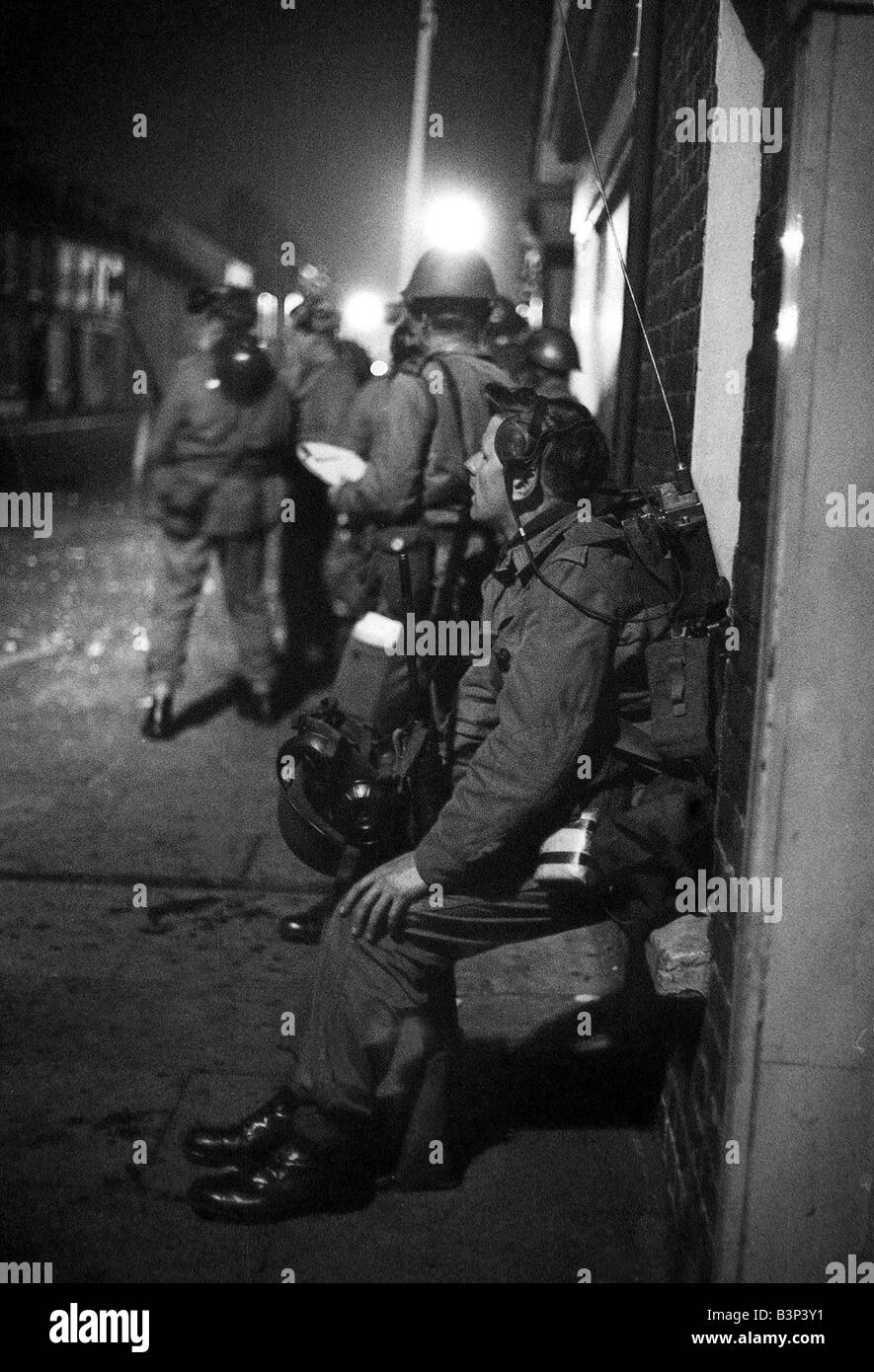 British Troops Army Soldiers October 1969 in Northern Ireland troops patrol the troubles In 1969 the Protestant unionist fanatics instigated a series of severe pre planned riots against the Catholics In August of 1969 the Protestants ripped through the streets of Belfast and Derry They went into neighborhoods and even some houses of Catholic people Then on August 12 the riots were turned over to the orange mobs of the UVF They blew clouds of tear gas through the Catholic neighborhoods On the 14th of August the Catholics rebelled through two days of vicious rioting During the two days of Stock Photo