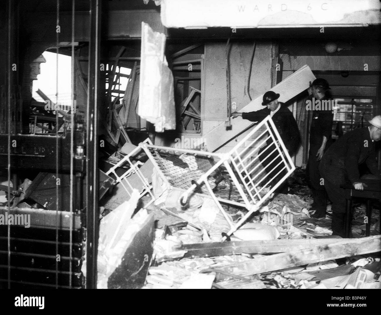 WW2 Air Raid Damage Rescue team searching through a bombed hospital ward during the blitz Stock Photo
