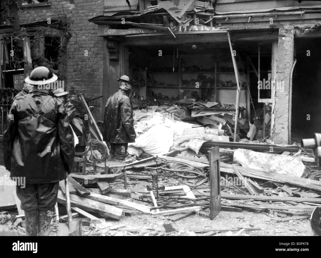 WW2 Air Raid Damage Rescue workers at a bombed site after during blitz Stock Photo