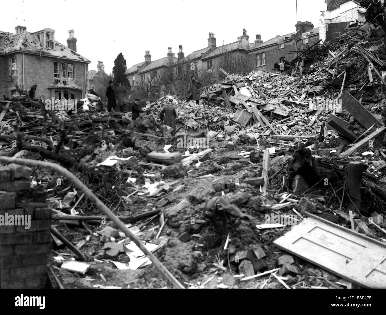 WW2 Air Raid Damage Coventry Civilians search the rubble of thier bomb damaged houses in Coventry On 14th November 1940 the whole of the centre of Coventry was totally devastated Stock Photo