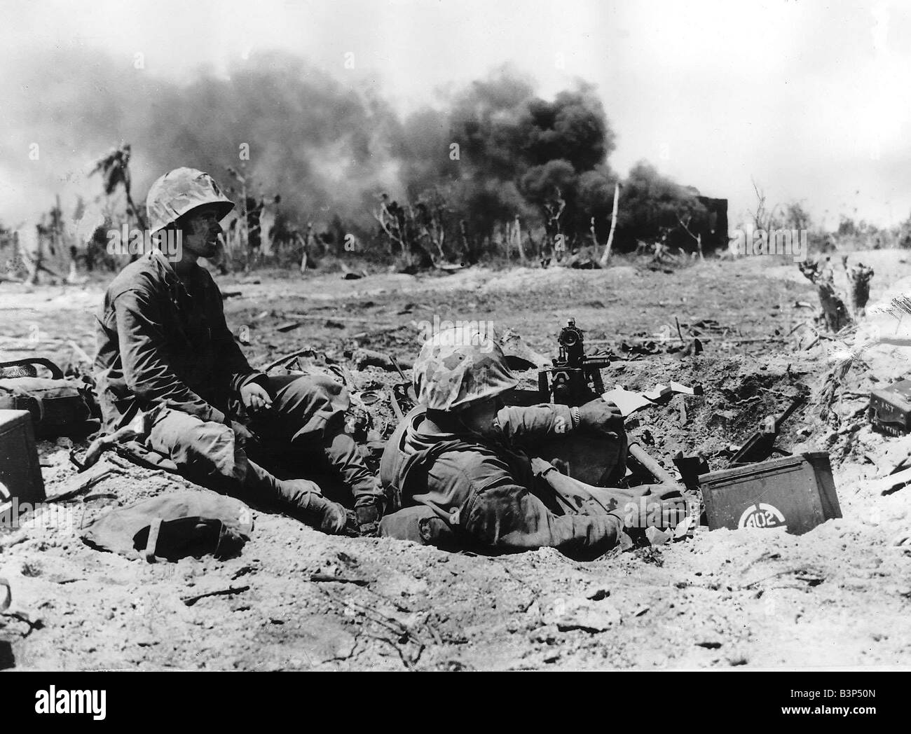 WW2 US marines on Namur Island 1944 Two marines relax in a machine gun