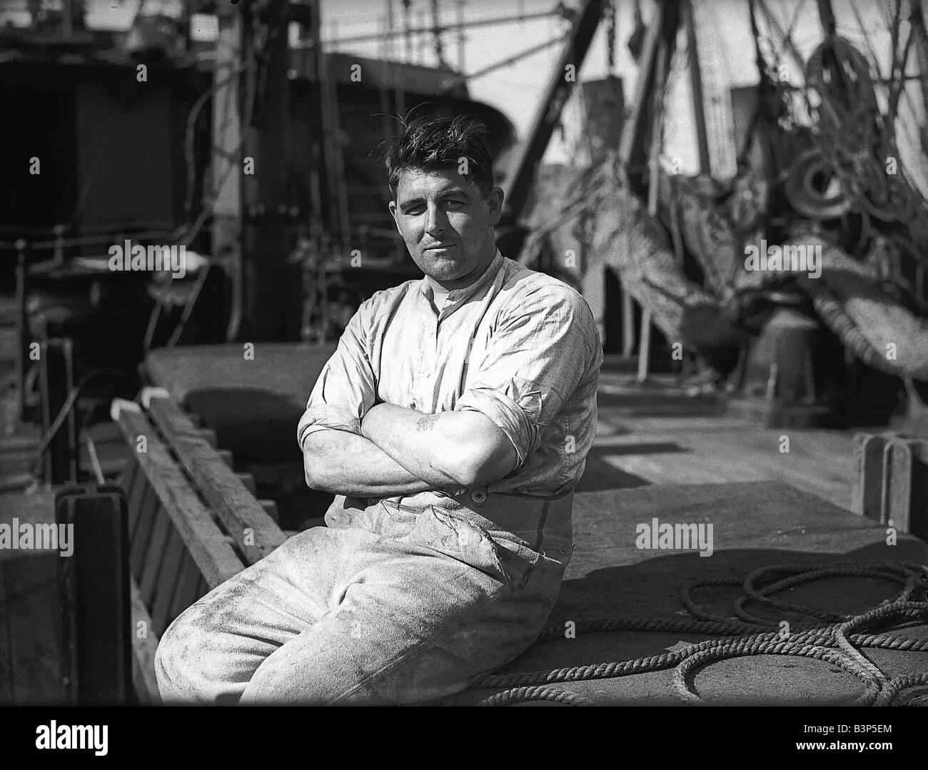 A merchant seaman in WW2 sitting on the deck of a ship Stock Photo - Alamy