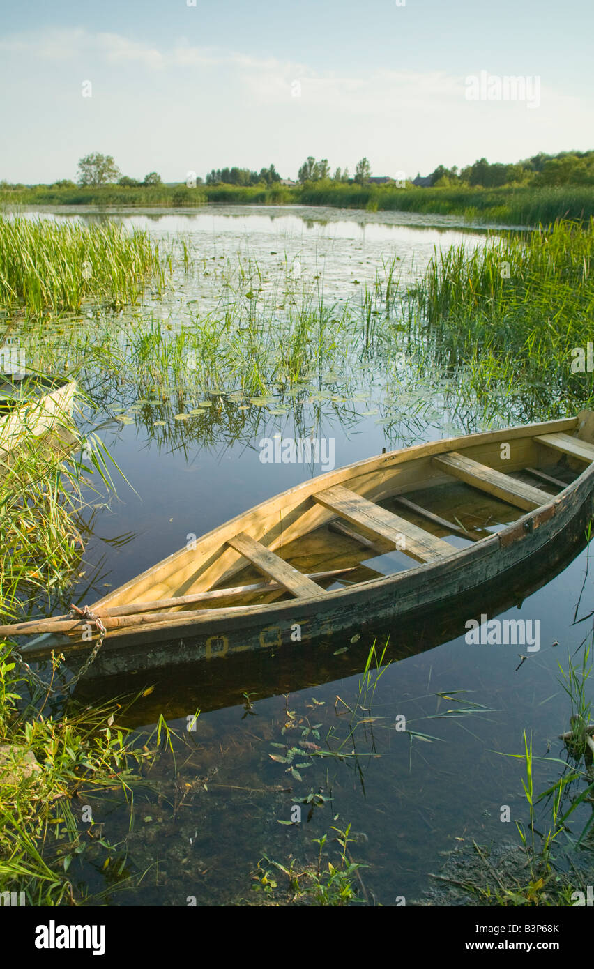 Sinking boat moored in an inlet on Lake Tyla Birzai northern Lithuania Stock Photo