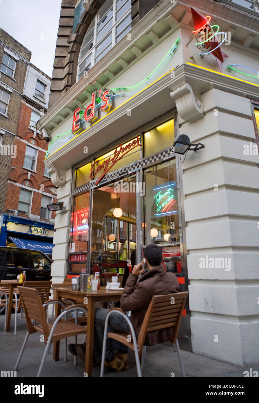 People Sitting Outside Eds Diner Soho West End London UK Europe Stock