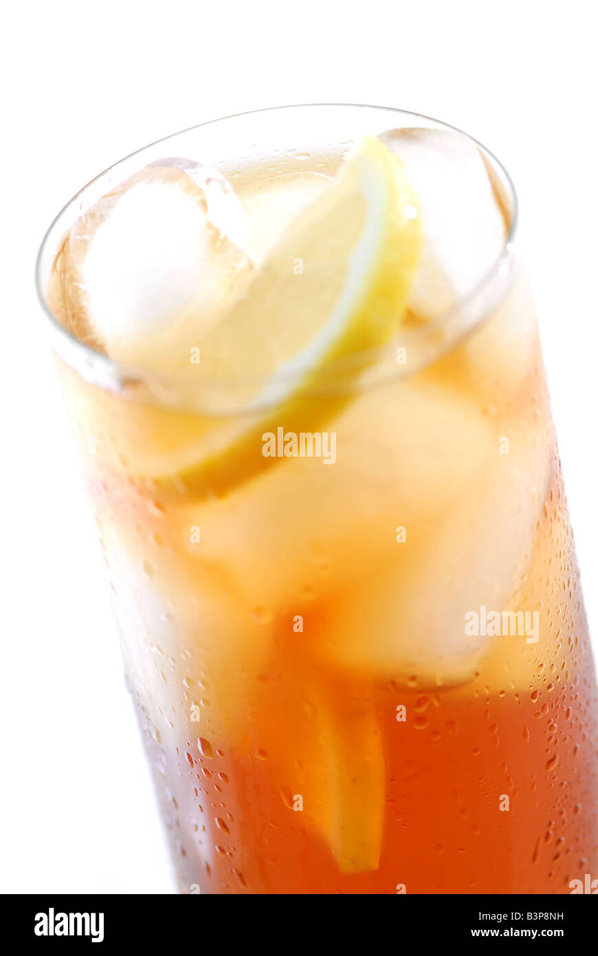 Glass of cold iced tea with water drops on surface focus on the drops ...
