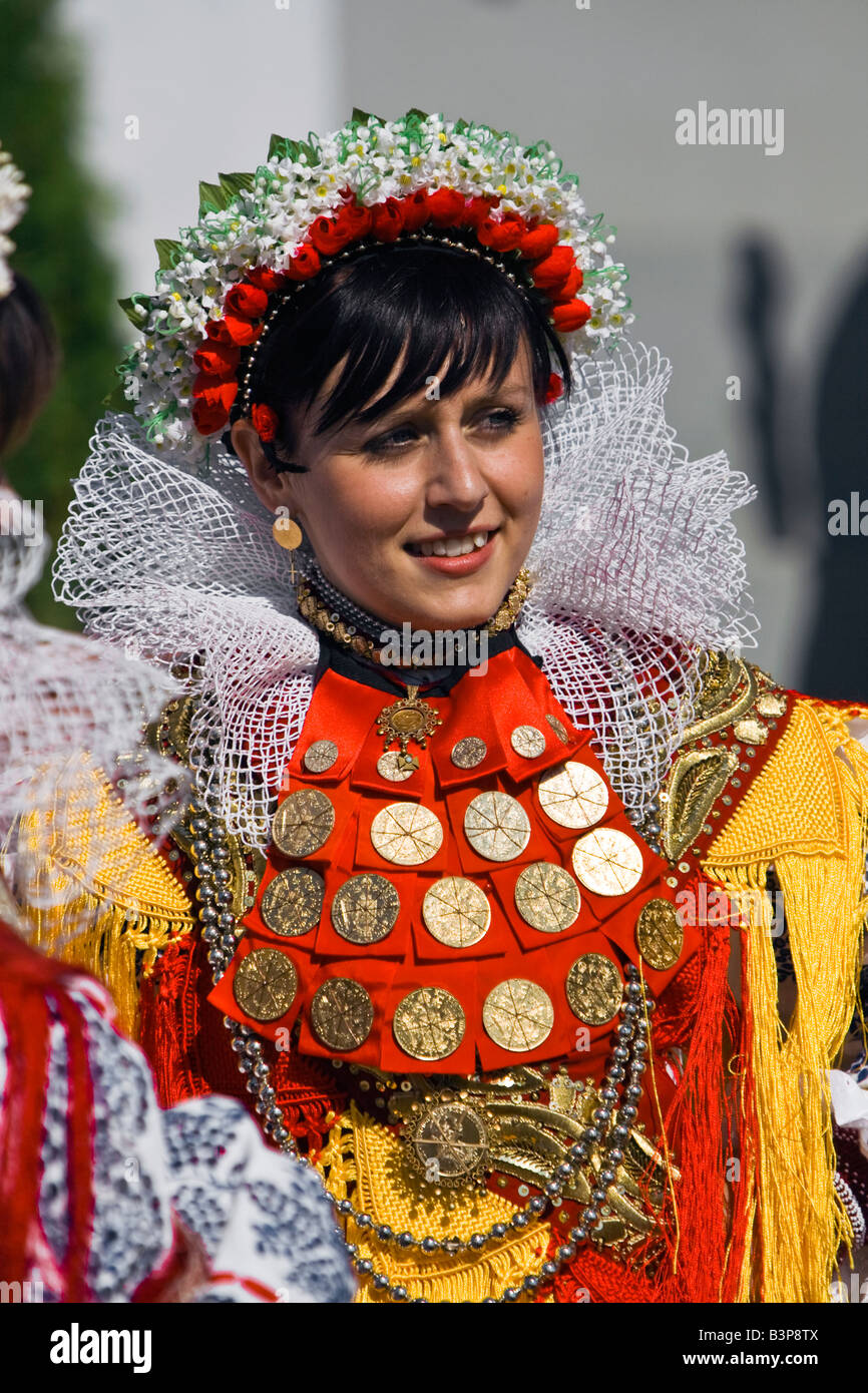 Girl in the Croatian traditional dress with ducats on the dress and headdress. Stock Photo