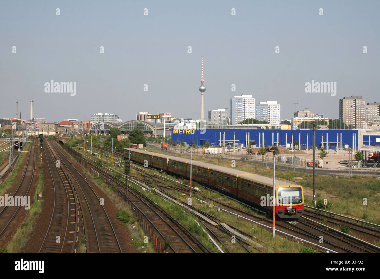 S Bahn train, Fernsehturm TV Tower and residential skyscrapers Berlin Germany  May 2008 Stock Photo