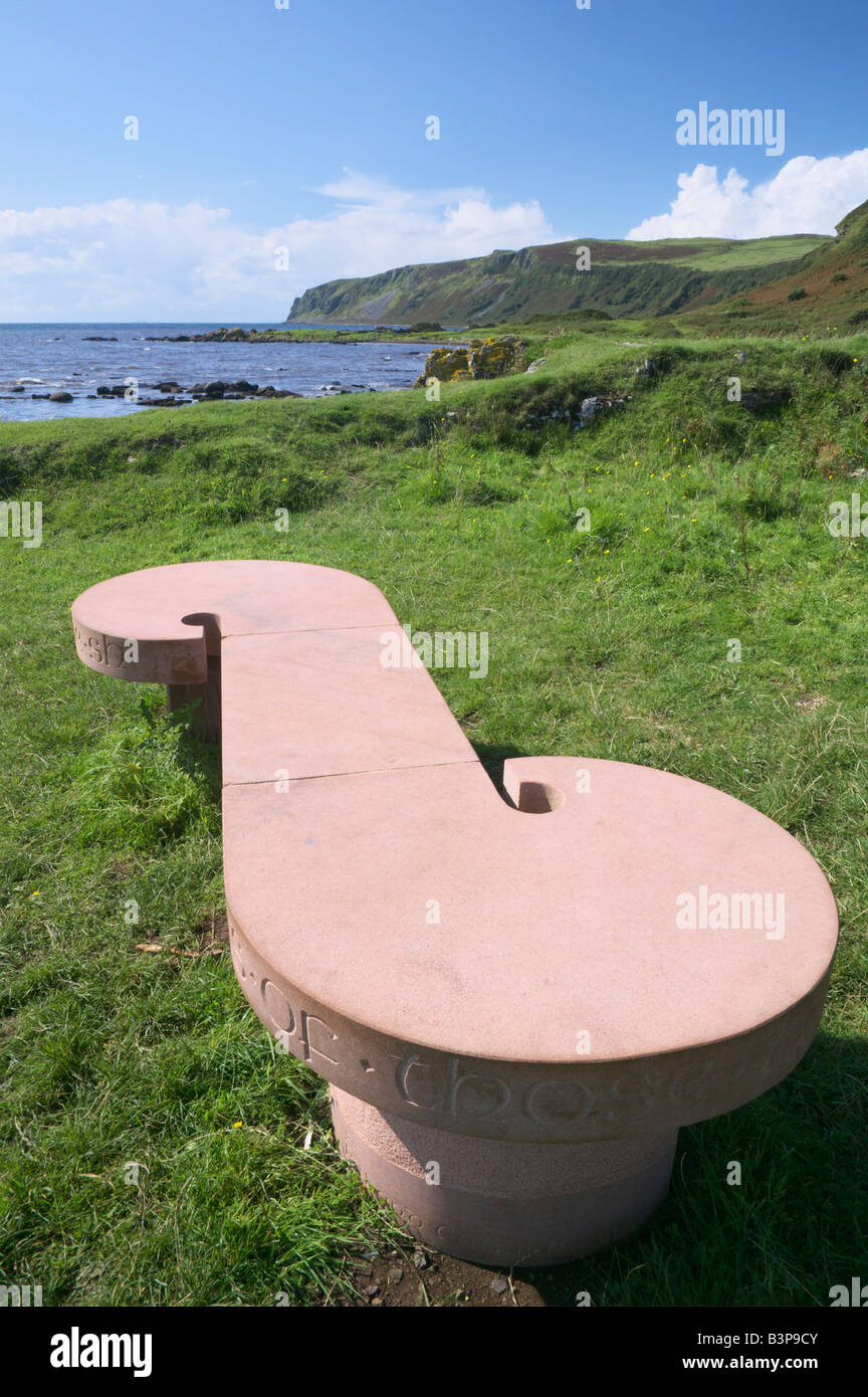 Sculpted stone bench with view towards Bennan Head, Auchenhew, near Kildonan, Isle of Arran, North Ayrshire, Scotland, UK. Stock Photo