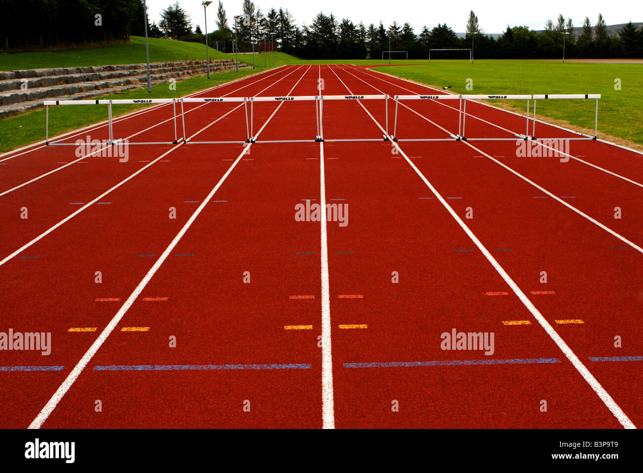 Running track and hurdles Stock Photo
