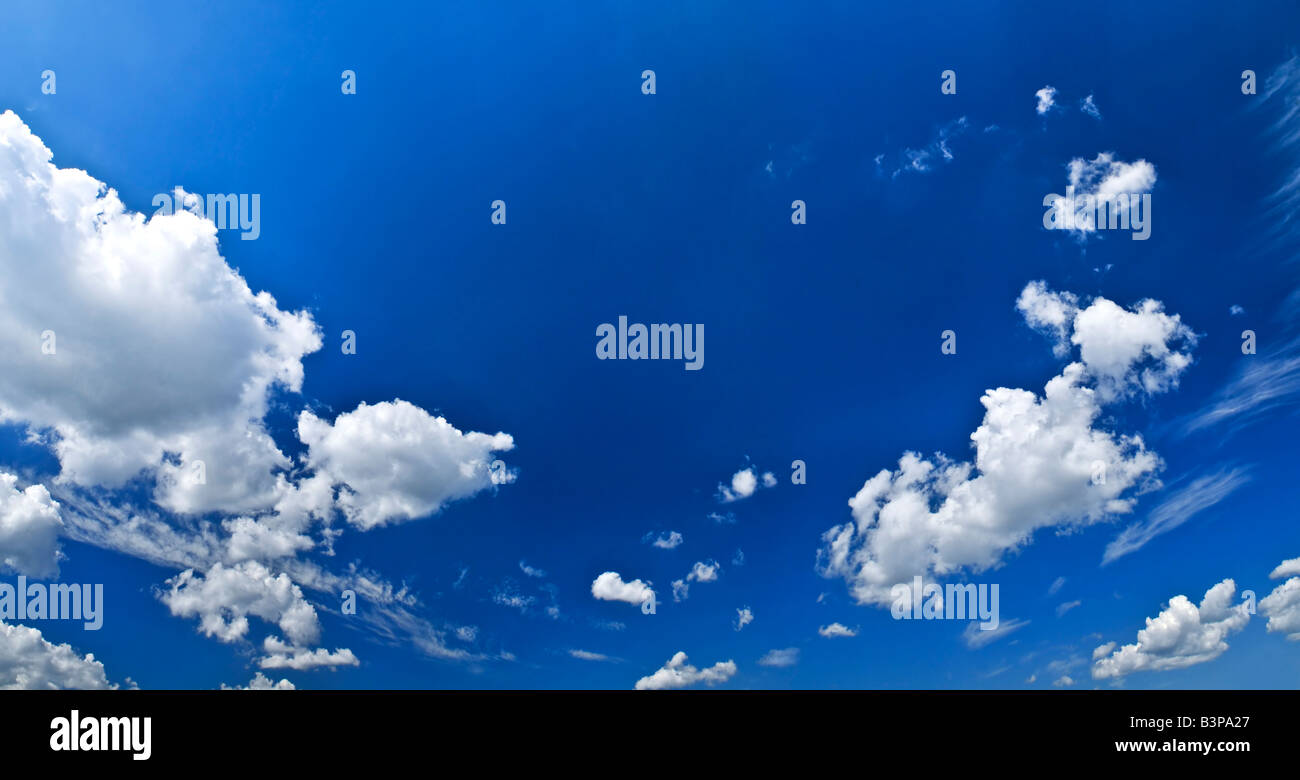 Panoramic background of blue sky with white cumulus clouds Stock Photo ...