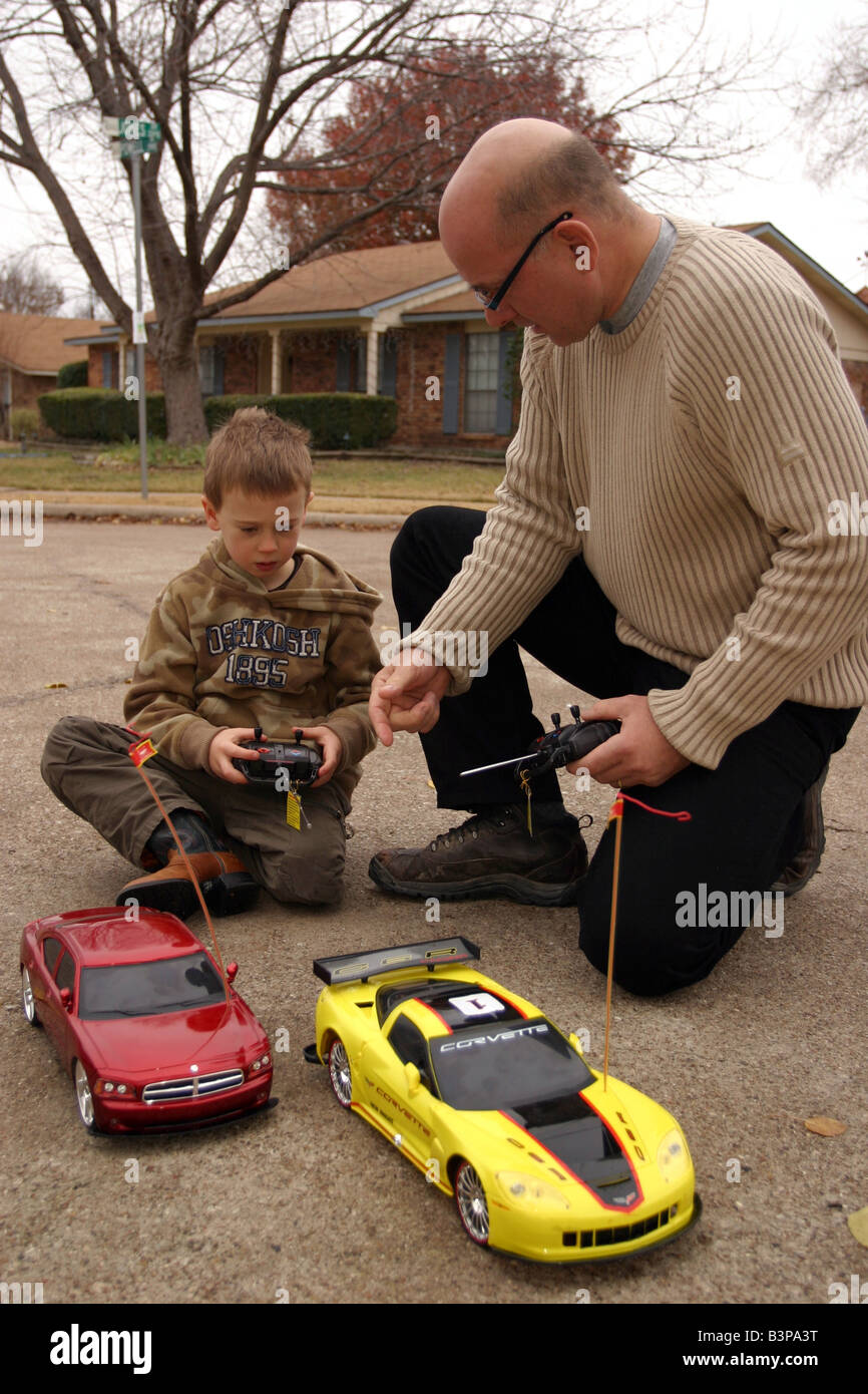 father and son racing remote control cars Stock Photo Alamy