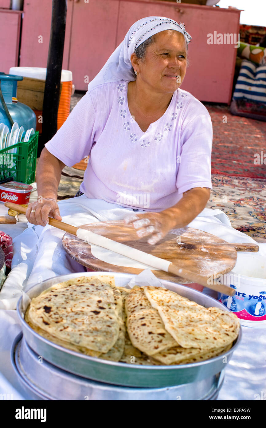 Traditional Turkish woman making pancakes Stock Photo