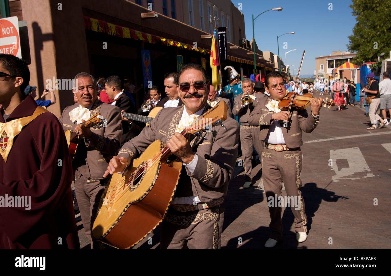 A procession moves along East San Francisco Street in downtown Santa Fe