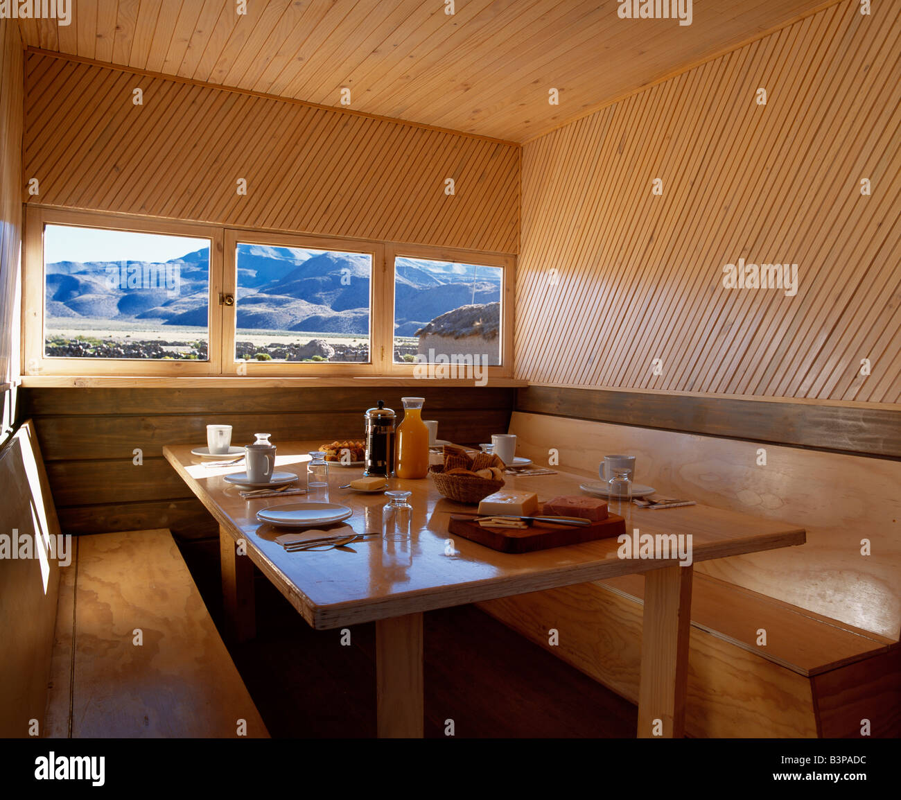 Chile, Parque Nacional Volcan Isluga. Camping in style. Breakfast laid out for guests inside Explora's camp kitchen and dining Stock Photo