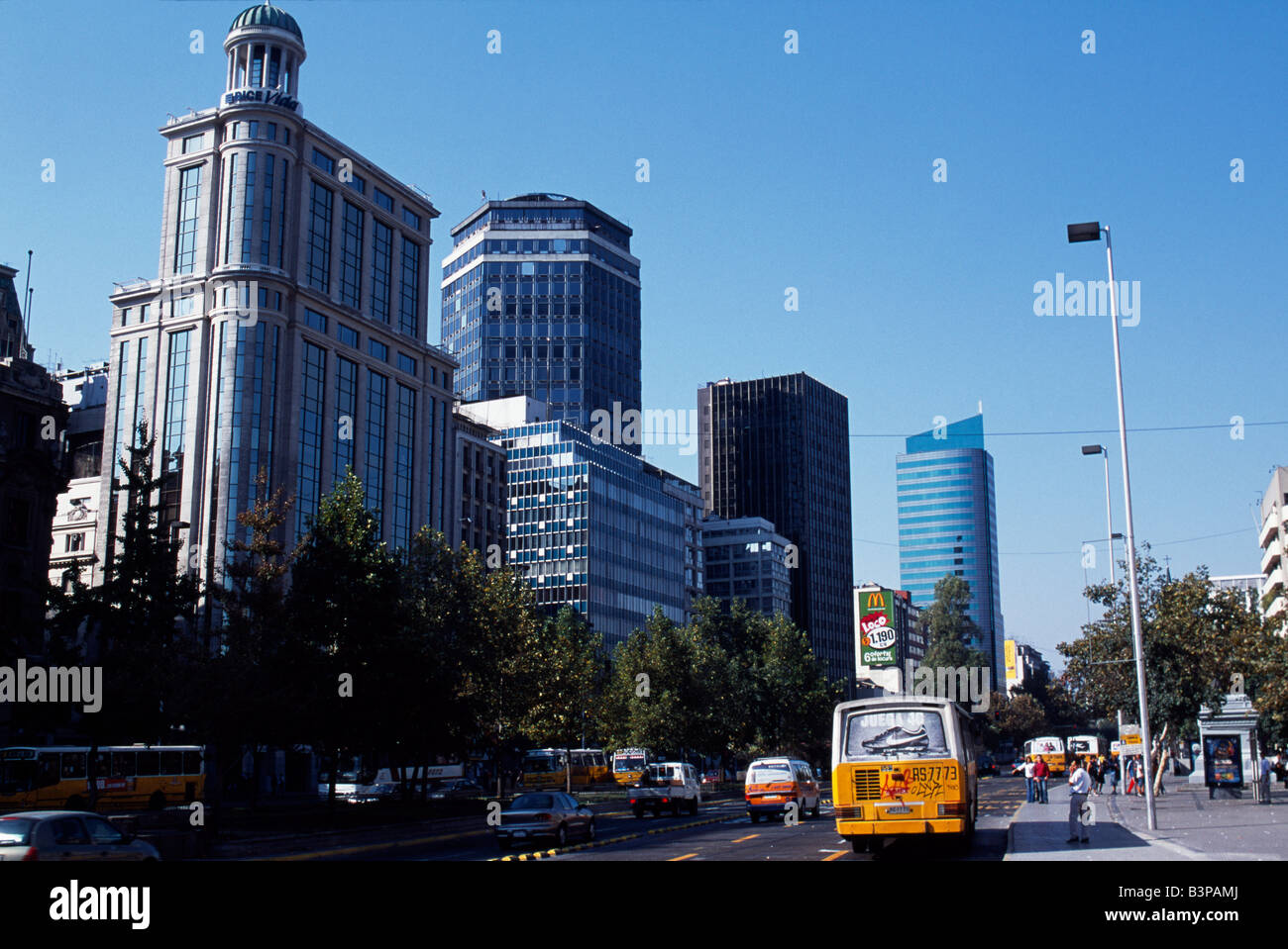Chile, Santiago. Avenida del Libertador Bernardo O'Higgins, Santiago's main east-west throughfare, colloquially known as La Alameda, is a busy dual carriageway flanked by a mix of old colonial buildings and striking modern skyscrapers. Stock Photo