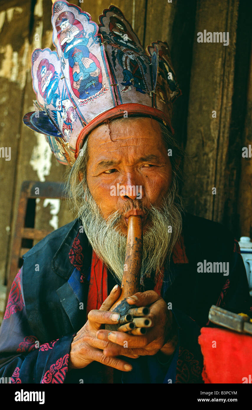 China, Yunnan Province, Lijiang. A Naxi Dongba, or 'wise man' and essentially a shaman, traditionally acted as a mediator with the spirit world. The Dongba religion is itself an off-shoot of Tibet's pre-Buddhist Bon religion. Stock Photo