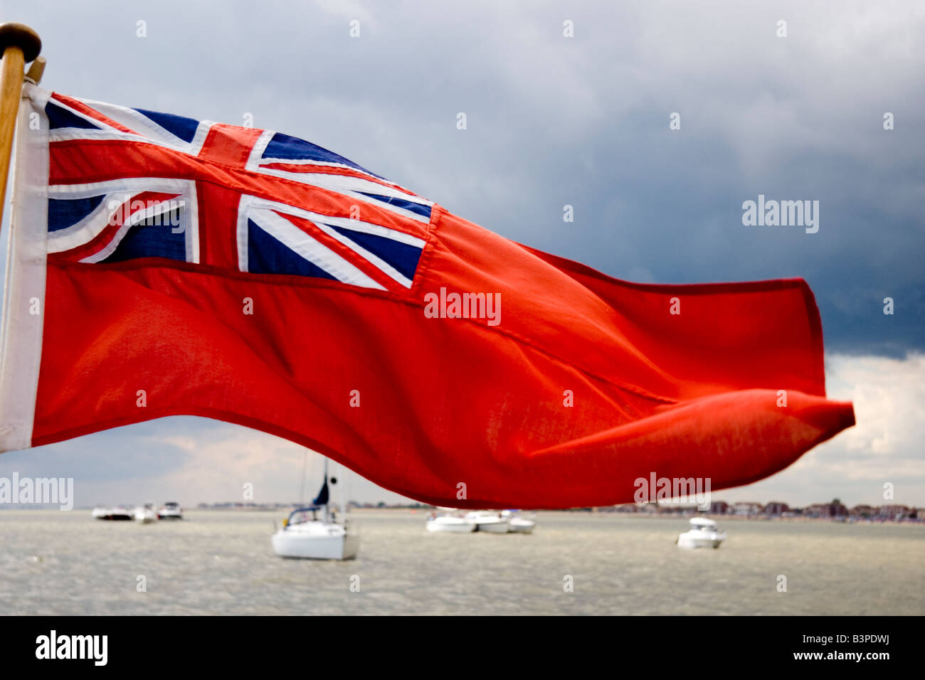 A British maritime flag called the Red Ensign or Red Duster Stock Photo