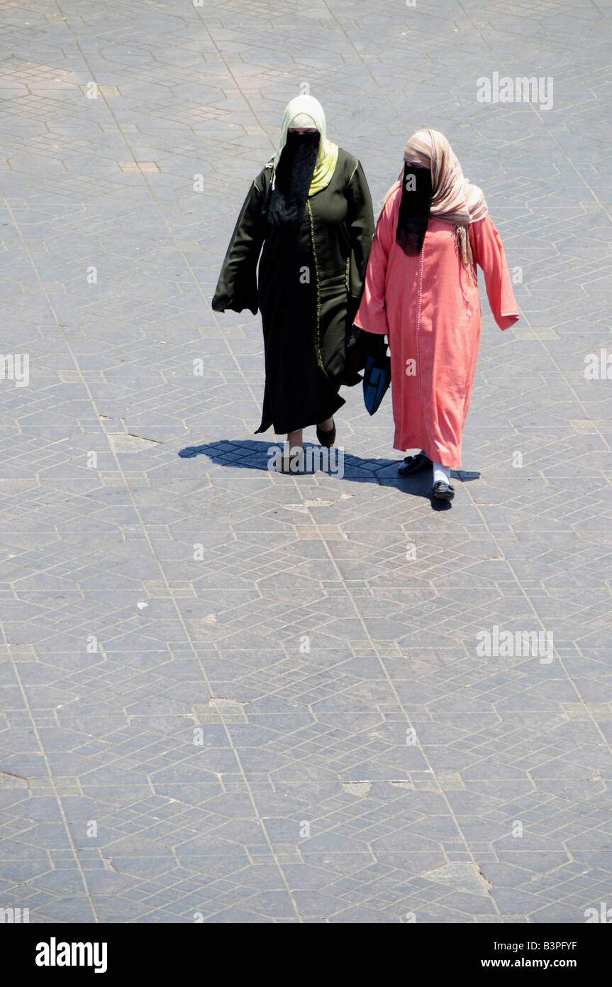 Two completely veiled women in the Djemma el-Fna Square, 'Imposter Square' or 'Square of the Hanged', Marrekesh, Morocco, Africa Stock Photo