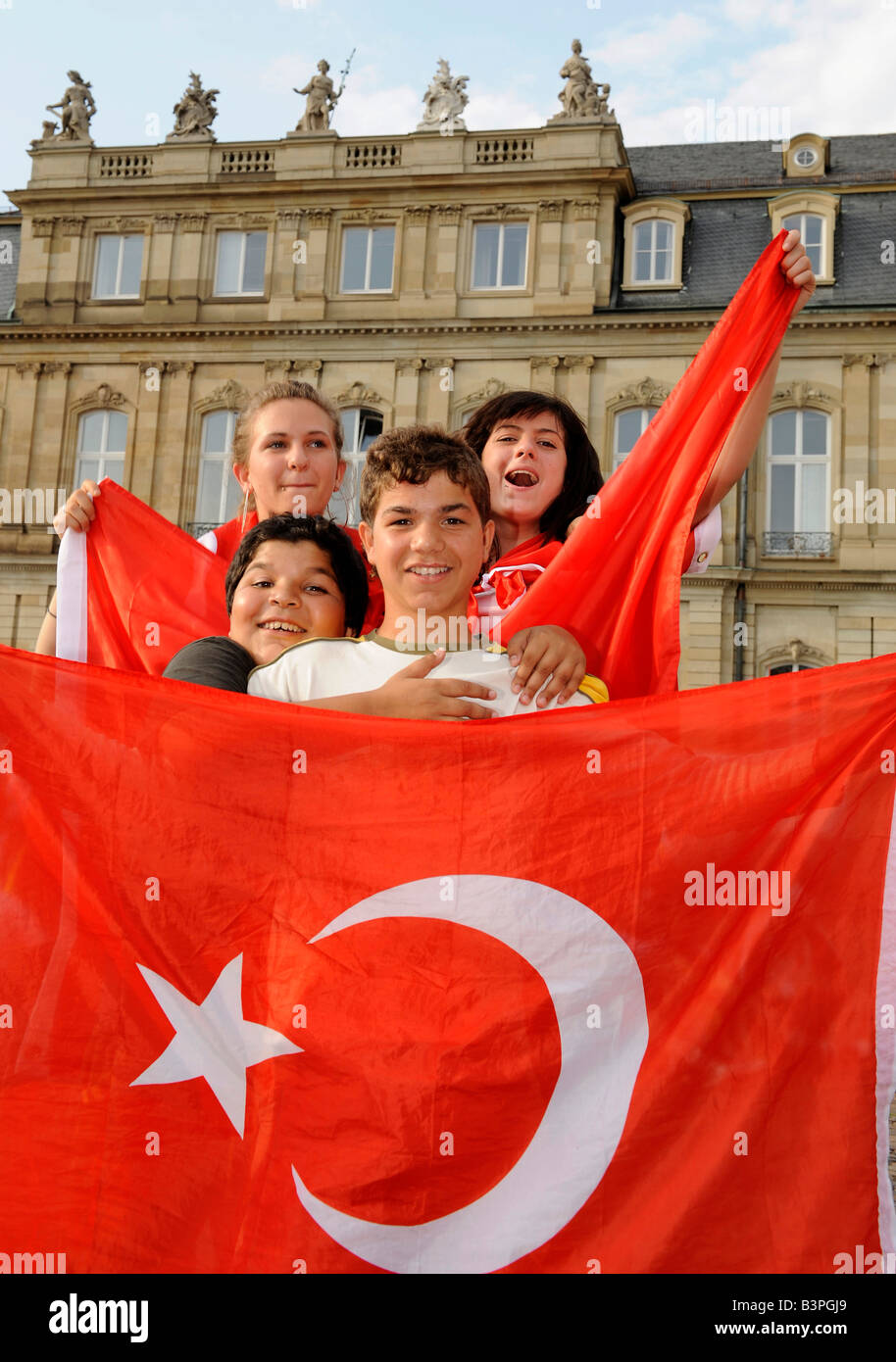 Fans of the Turkish national team with flags celebrating on Schlossplatz Square in Stuttgart, Baden-Wuerttemberg Stock Photo