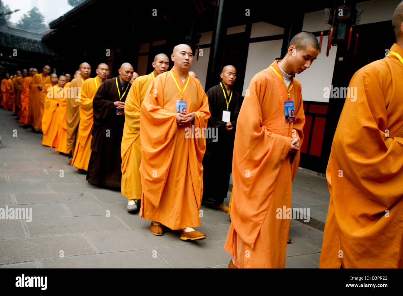 Line of monks in various colored robes Stock Photo Alamy