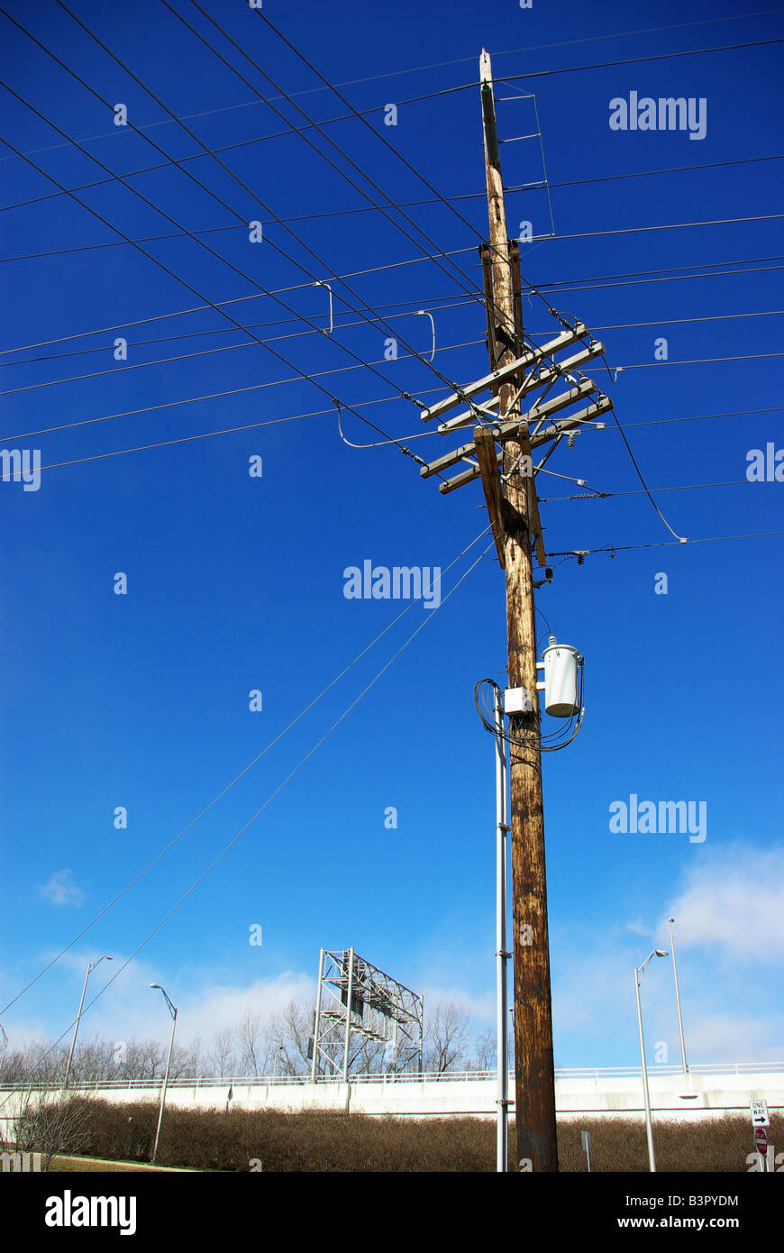 A telephone pole stands against a snowy background Stock Photo Alamy