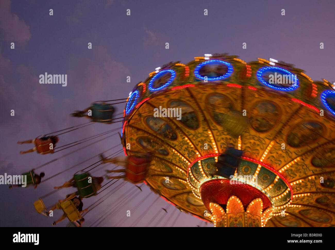 People on an amusement park ride Stock Photo - Alamy