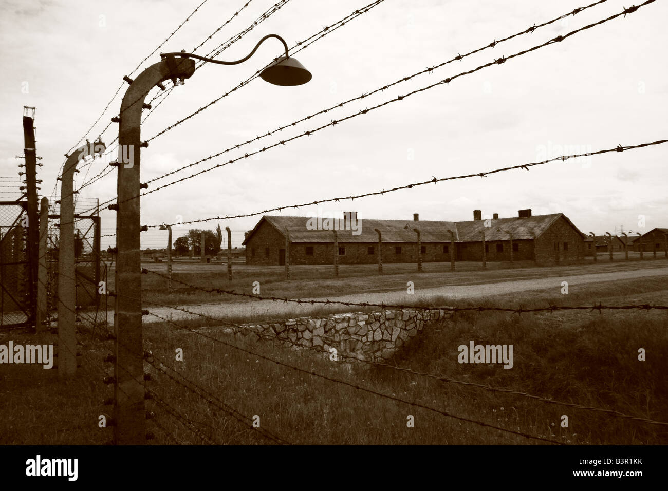 Barbed wire fence at Auschwitz-birkenau (aka. Aushwitz II), concentration camp near Krakow, Poland Stock Photo