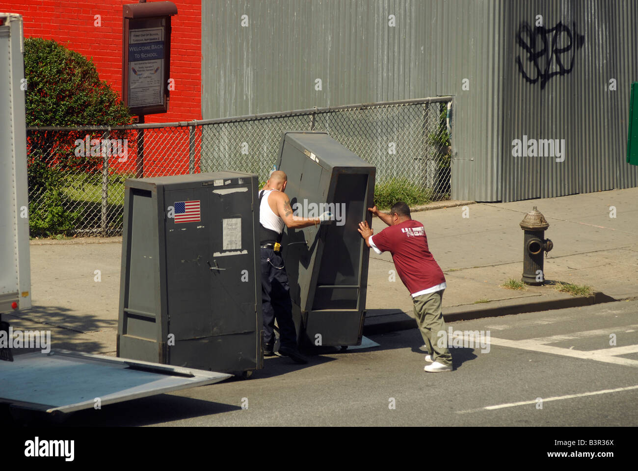 Workers for the New York City Board of Elections deliver voting