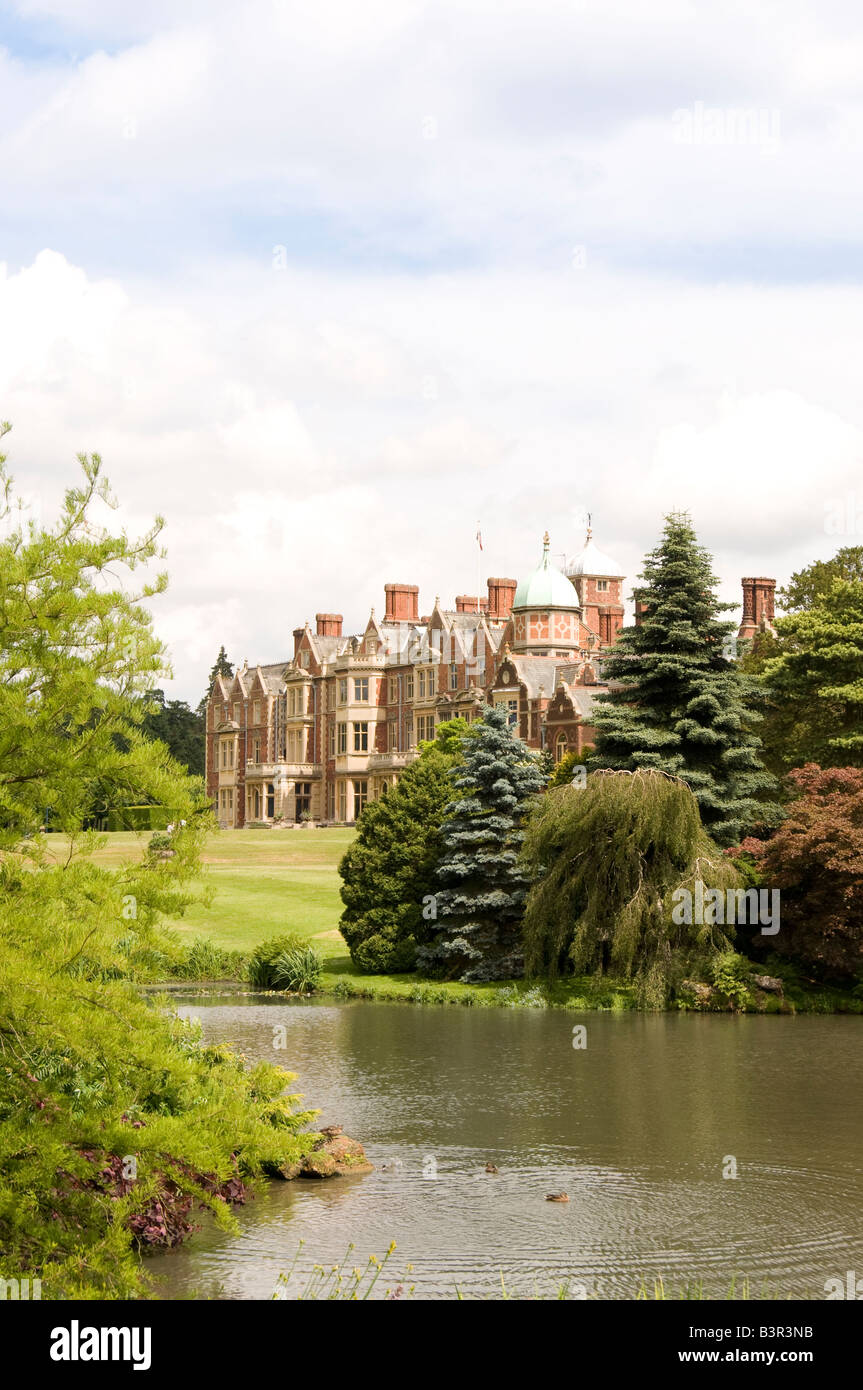 The west elevation of Sandringham seen across the lake of the dell Stock Photo