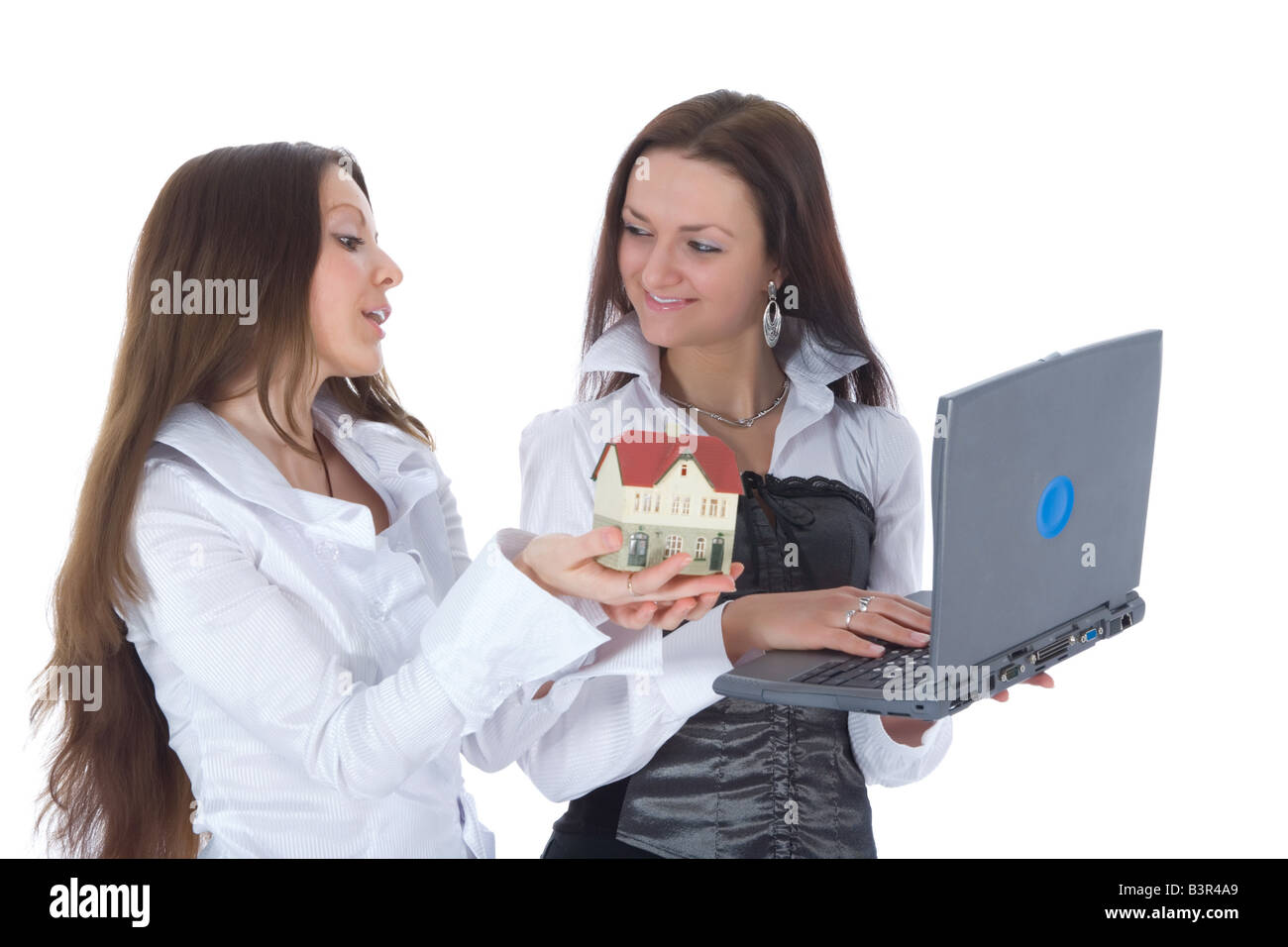 Two business woman advertises real estate on white Stock Photo - Alamy