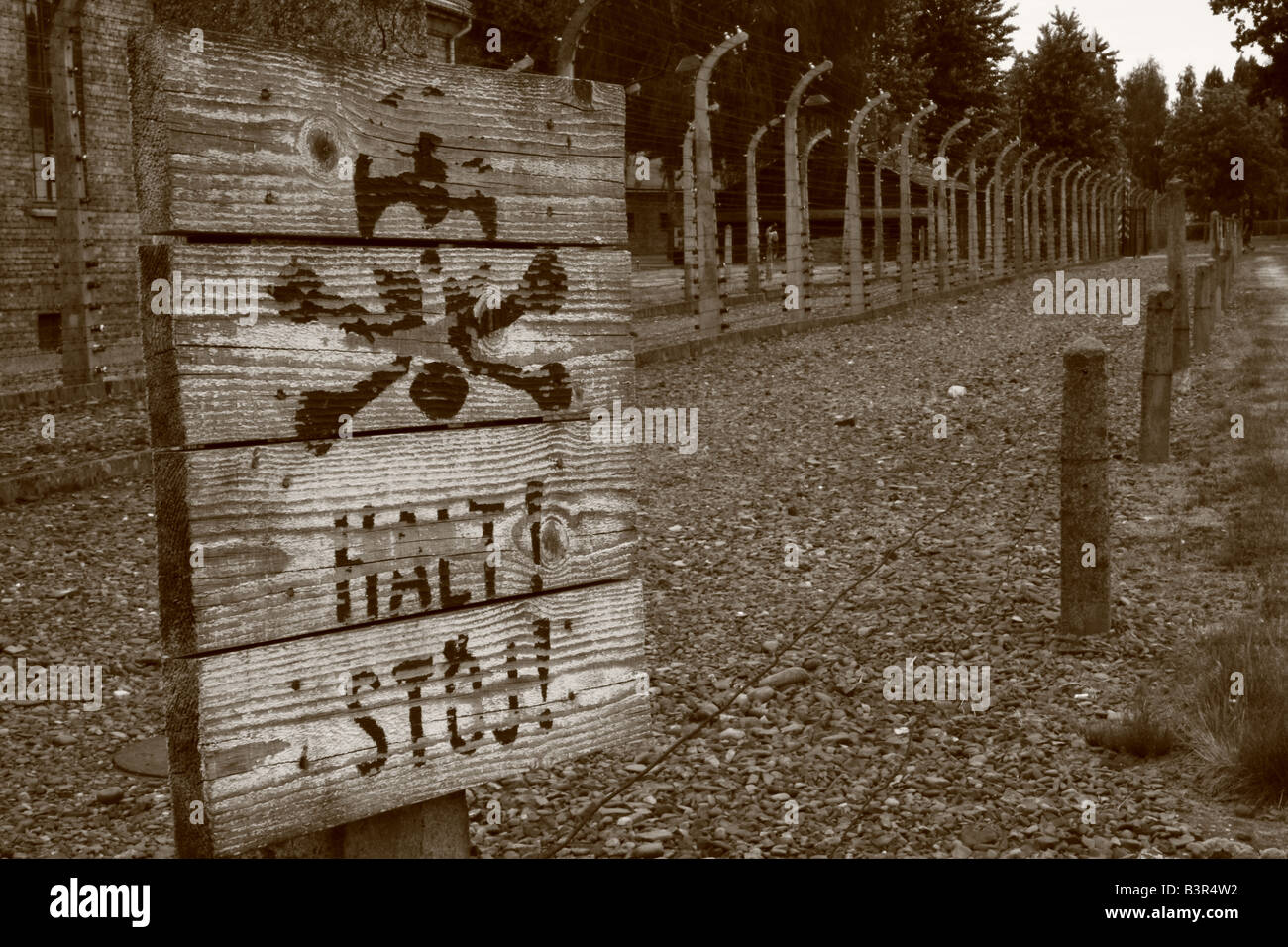 Warning sign with skull and cross bones at Auschwitz concentration camp near Krakow, Poland Stock Photo