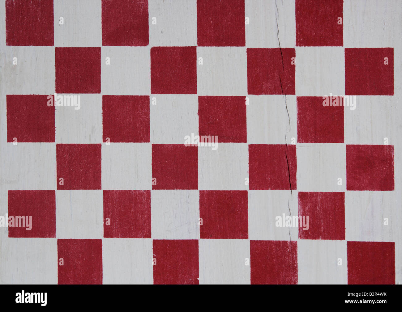 a red stenciled wood checkerboard Stock Photo