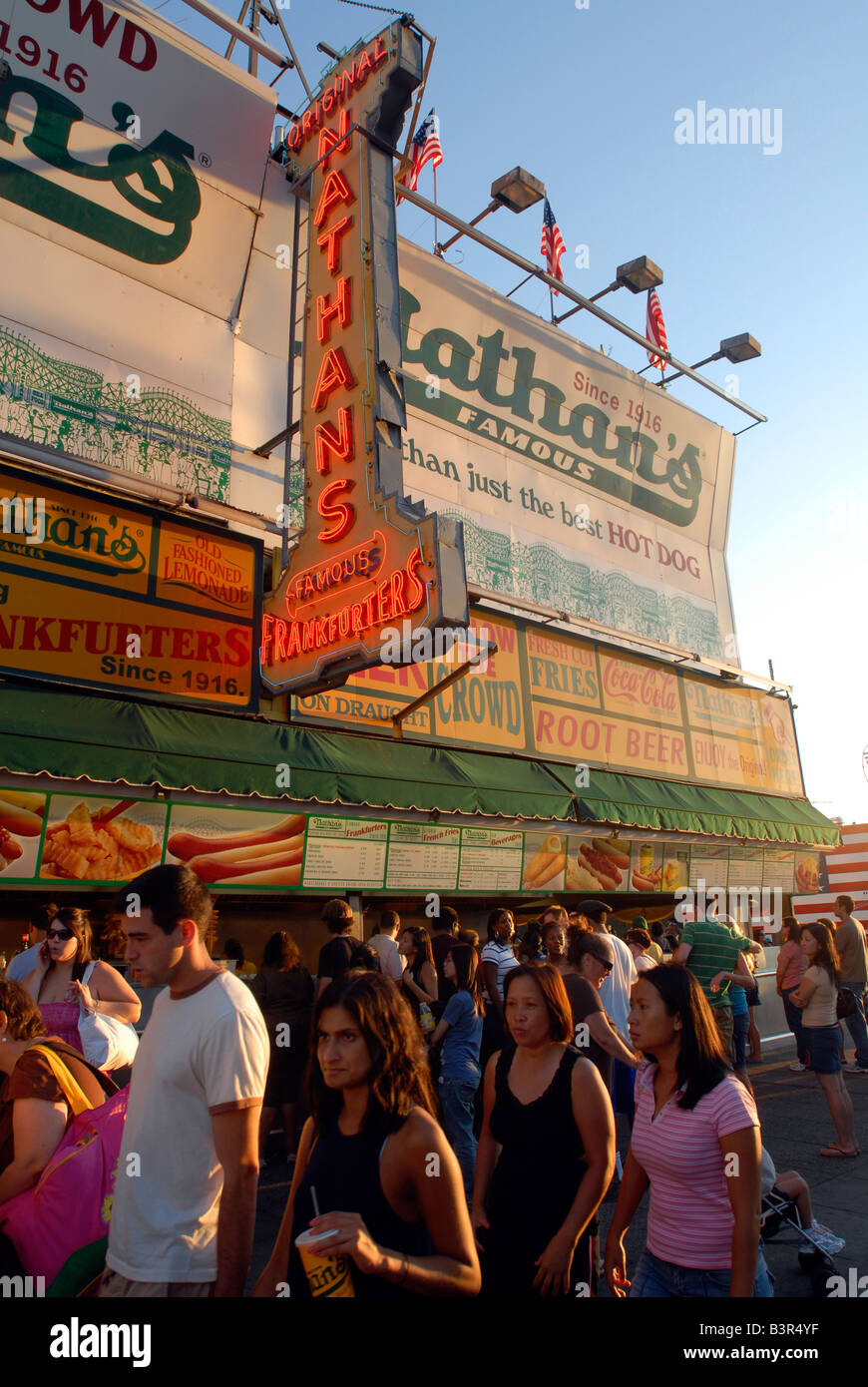 Visitors to Coney Island eat at Nathan s Famous Stock Photo Alamy