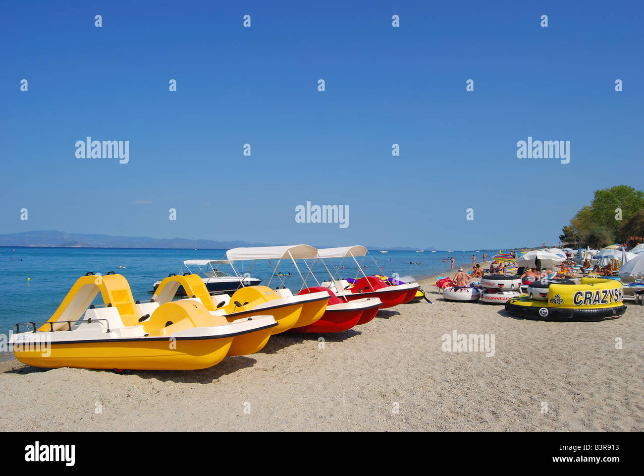Beach view showing watersports equipment, Hanioti, Kassandra Peninsula, Chalkidiki, Central Macedonia, Greece Stock Photo