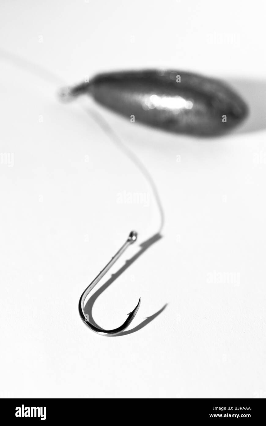 Fishing hook, line and sinker Stock Photo - Alamy