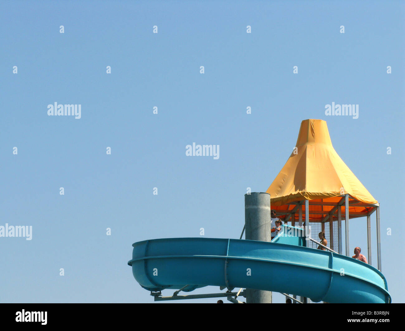 Top of water slide against blue sky Stock Photo