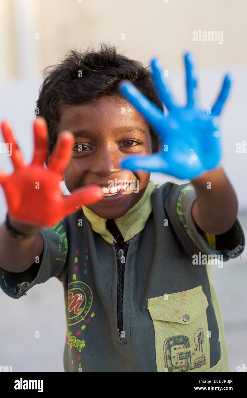Indian Child Color Hand Indian boy with blue red painted hands Stock Photo - Alamy