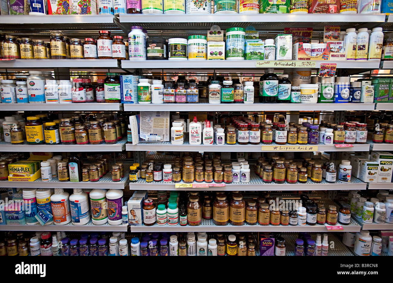 Vitamin and herbal supplement display shelves in a health food store Stock Photo