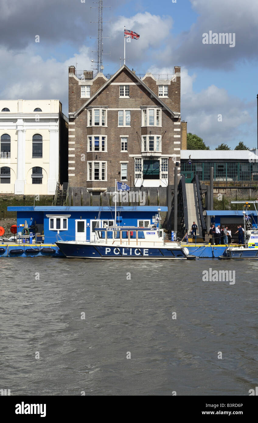 London Wapping Police Station on the River Thames is headquarters of the Metropolitan Police Marine Support Unit with boats Stock Photo