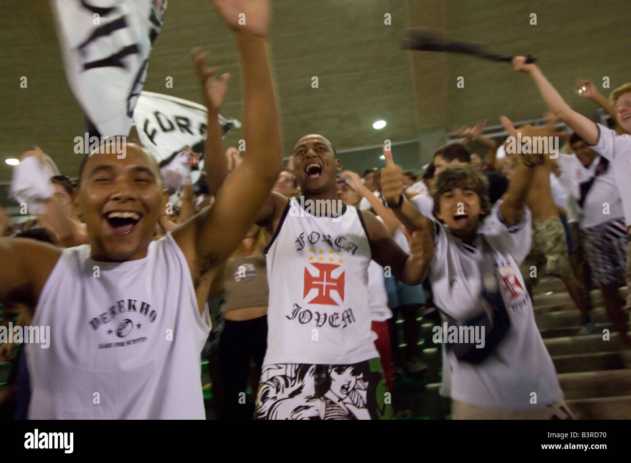 Local Brazilians cheer as a goal is scored at a football match at the Maracana stadium in Rio between Vasco and Fluminense. Stock Photo