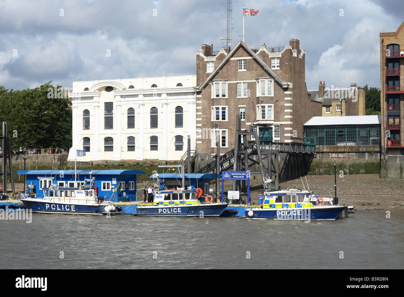 London Wapping Police Station on the River Thames is headquarters of the Metropolitan Police Marine Support Unit with boats Stock Photo